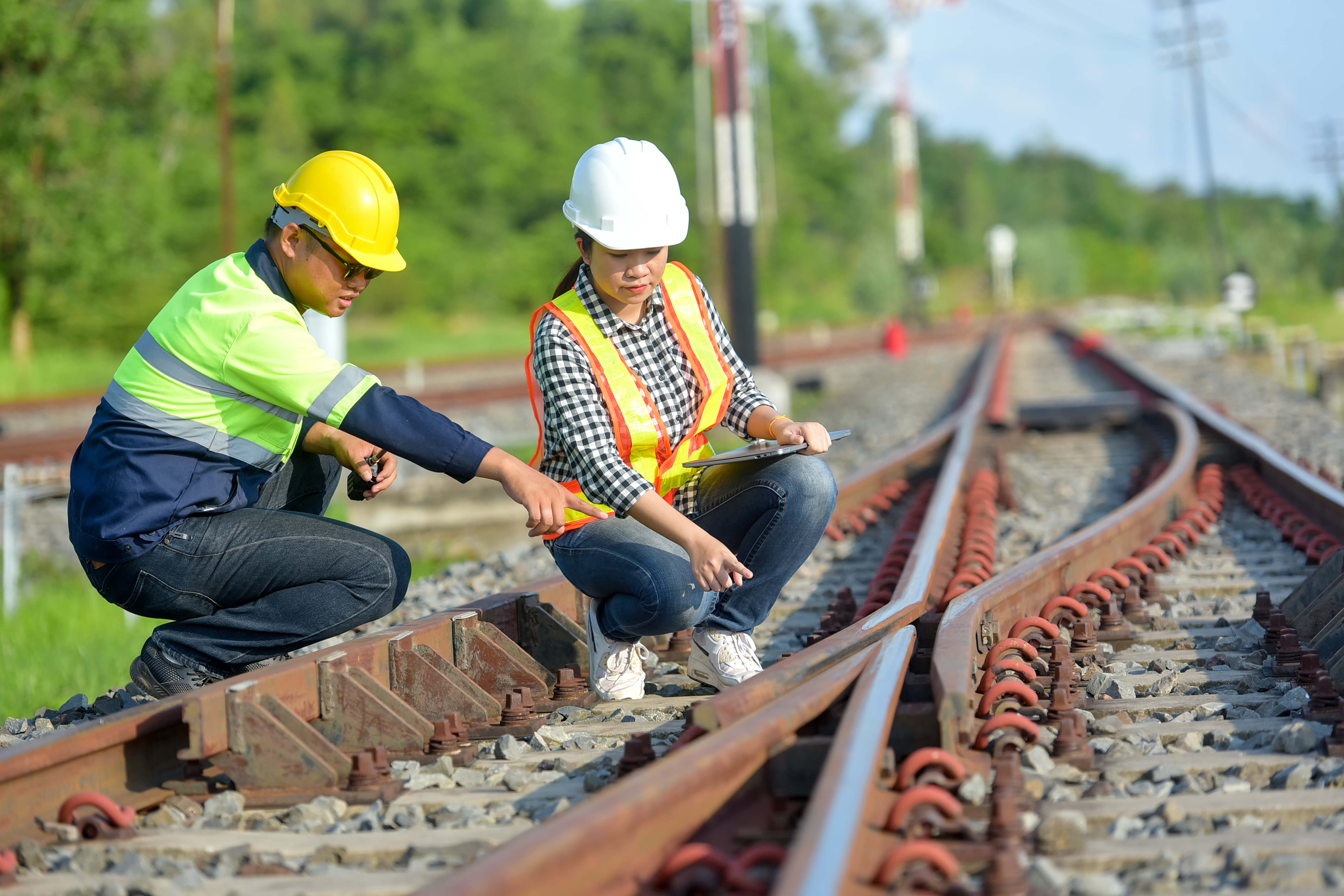 Rail engineers inspecting track in Australian landscape